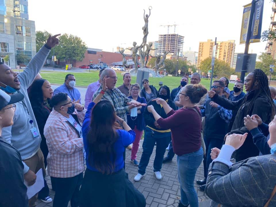 Participants energetically engaging in an outdoor challenge during the Pub Crawl Scavenger Hunt, fostering team spirit and connection in a lively city setting.