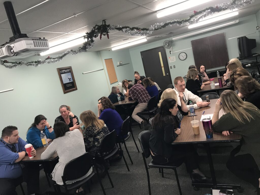 Teams participate in group discussions during a team building session, collaborating and exchanging ideas to strengthen workplace relationships.